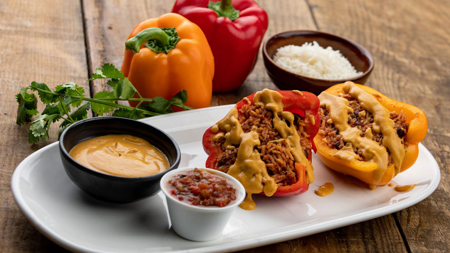 Stuffed Peppers with Rice and Black Beans with Cashew-based Cheese Sauce